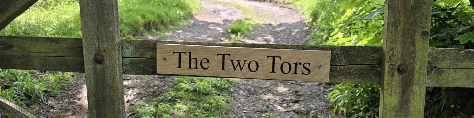 Panoramic view of the wooden gate at The Two Tors on Dartmoor